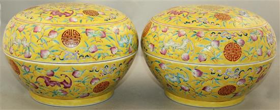 A pair of Chinese famille rose yellow ground boxes and covers, second half 19th century, 24.5cm diam.